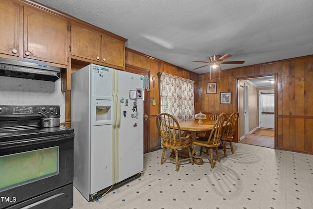 4038 Redwood Rd, Durham, NC 27704 - kitchen featuring black range with electric stovetop, white refrigerator with ice dispenser, light floors, brown cabinets, and under cabinet range hood