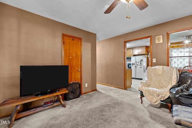 4038 Redwood Rd, Durham, NC 27704 - carpeted living room featuring ceiling fan and baseboards