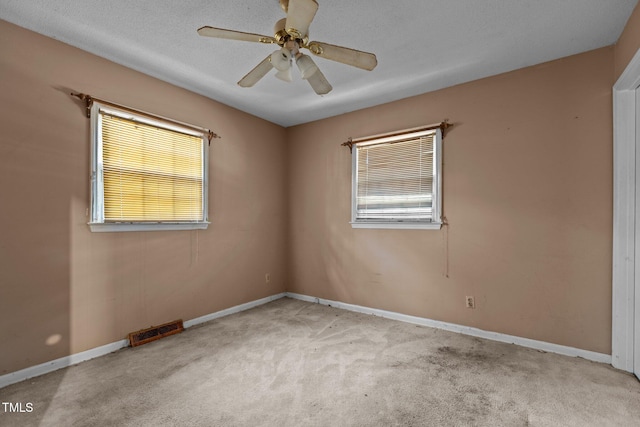 4038 Redwood Rd, Durham, NC 27704 - empty room featuring carpet floors, a ceiling fan, and baseboards