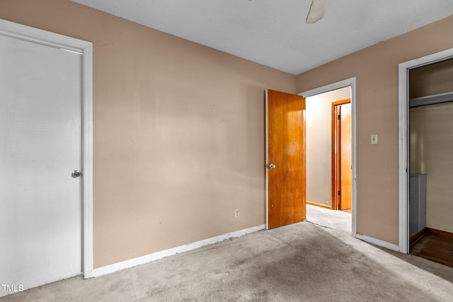 4038 Redwood Rd, Durham, NC 27704 - unfurnished bedroom with carpet floors, baseboards, and a ceiling fan
