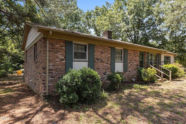 4038 Redwood Rd, Durham, NC 27704 - single story home with brick siding and a chimney