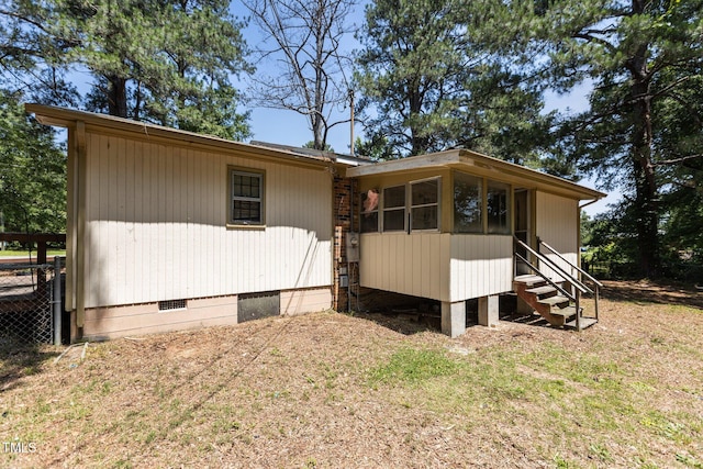 4038 Redwood Rd, Durham, NC 27704 - view of side of home with crawl space and entry steps