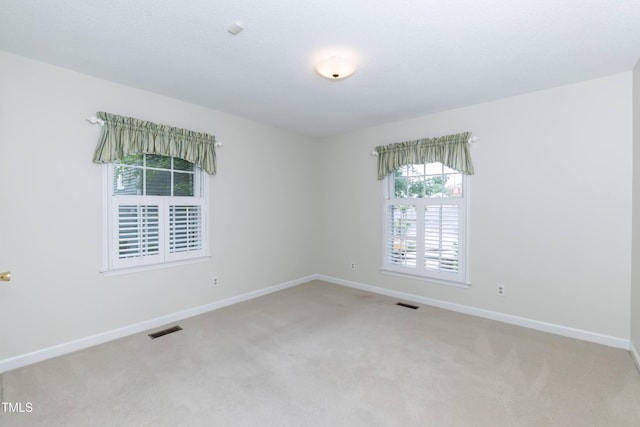 303 Spring St, Louisburg, NC 27549 - spare room with light colored carpet and baseboards