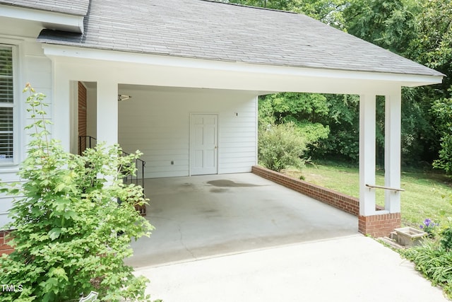 303 Spring St, Louisburg, NC 27549 - view of patio / terrace with a carport and concrete driveway