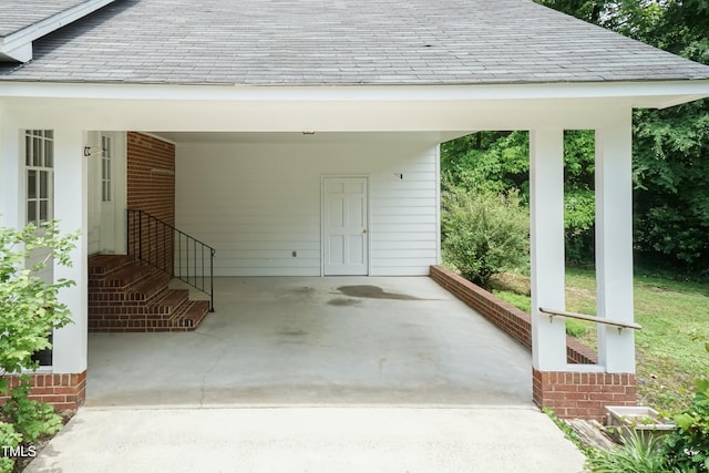 303 Spring St, Louisburg, NC 27549 - doorway to property featuring a shingled roof and an attached carport