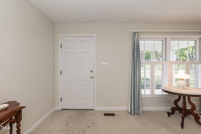 303 Spring St, Louisburg, NC 27549 - foyer featuring light carpet and baseboards