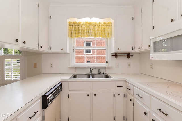303 Spring St, Louisburg, NC 27549 - kitchen with a sink, white appliances, white cabinetry, light countertops, and ornamental molding