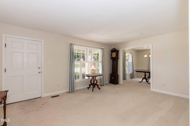 303 Spring St, Louisburg, NC 27549 - carpeted entrance foyer with baseboards