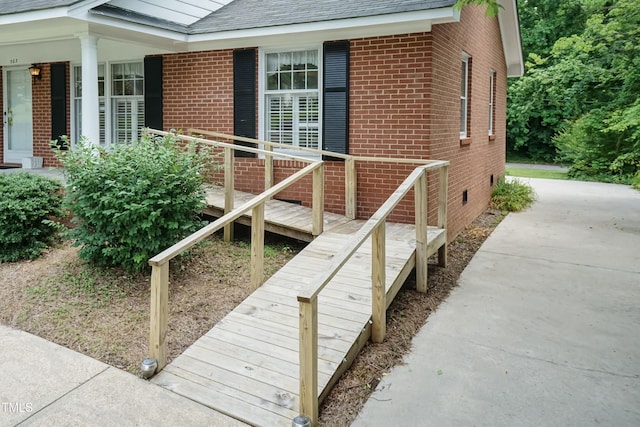 303 Spring St, Louisburg, NC 27549 - view of side of property with brick siding and roof with shingles