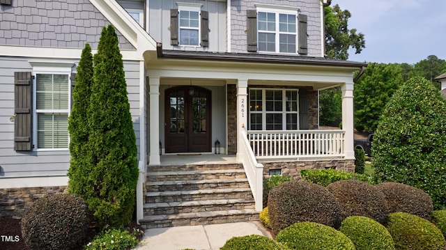 2661 Silver Bend Dr, Apex, NC 27539 - doorway to property featuring a porch and stone siding