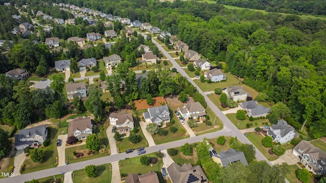 2661 Silver Bend Dr, Apex, NC 27539 - aerial view of property and surrounding area featuring nearby suburban area and a heavily wooded area