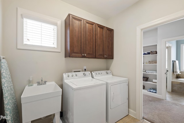 2661 Silver Bend Dr, Apex, NC 27539 - laundry room with cabinet space, washer and dryer, and light tile patterned floors