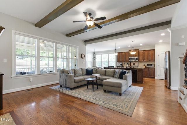 2661 Silver Bend Dr, Apex, NC 27539 - living room featuring beam ceiling, a ceiling fan, wood finished floors, baseboards, and recessed lighting