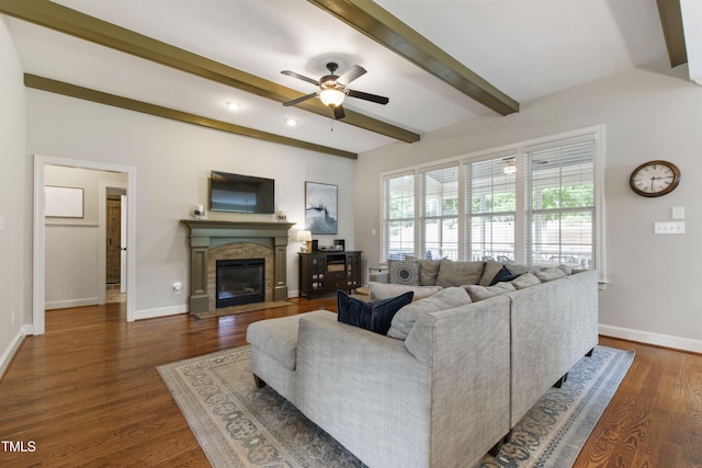 2661 Silver Bend Dr, Apex, NC 27539 - living area featuring a ceiling fan, beam ceiling, baseboards, a fireplace with flush hearth, and dark wood-style floors