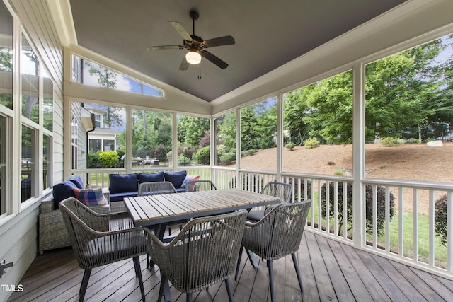 2661 Silver Bend Dr, Apex, NC 27539 - wooden deck with outdoor lounge area, ceiling fan, view of wooded area, and outdoor dining space