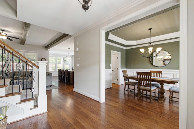 2661 Silver Bend Dr, Apex, NC 27539 - dining room featuring stairway, a chandelier, dark wood-style floors, ceiling fan, and wainscoting