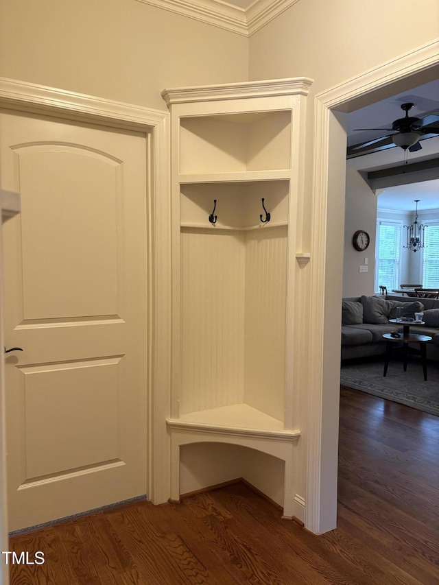 2661 Silver Bend Dr, Apex, NC 27539 - mudroom featuring dark wood-style flooring, crown molding, ceiling fan, and a chandelier