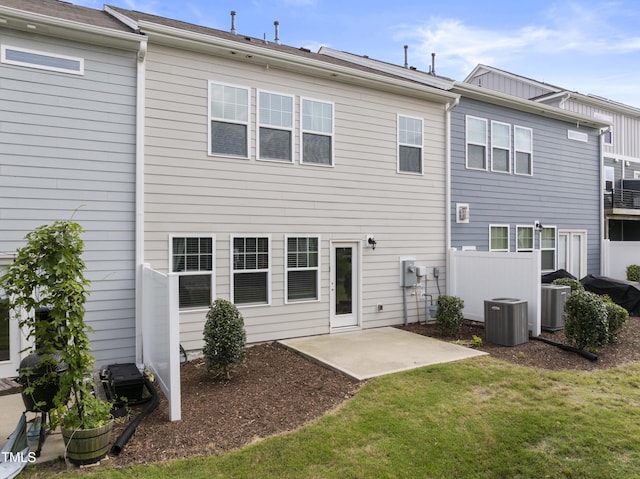 409 Rhamkatte Rd, Holly Springs, NC 27540 - rear view of house featuring central AC and a patio area