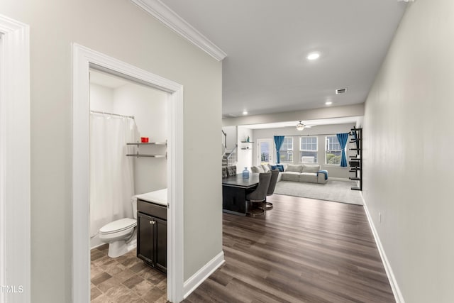 409 Rhamkatte Rd, Holly Springs, NC 27540 - hall featuring baseboards, recessed lighting, ornamental molding, and dark wood-type flooring