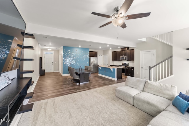 409 Rhamkatte Rd, Holly Springs, NC 27540 - living area featuring a ceiling fan, dark wood-style flooring, stairs, recessed lighting, and baseboards