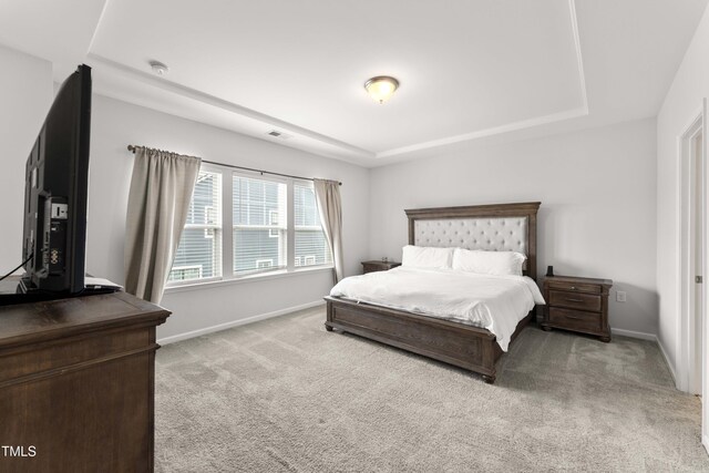 409 Rhamkatte Rd, Holly Springs, NC 27540 - carpeted bedroom with a raised ceiling and baseboards