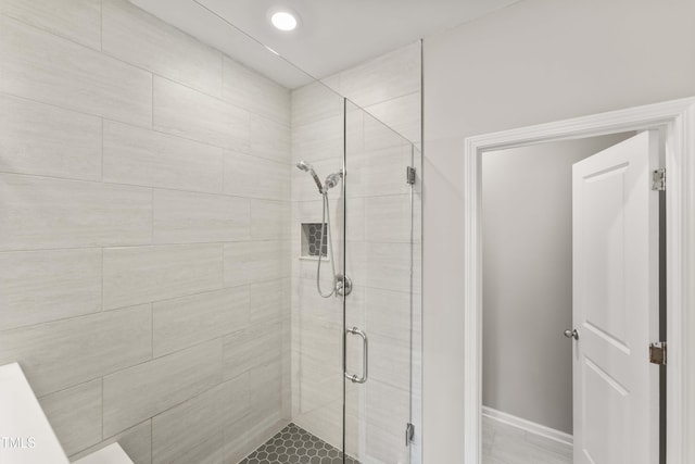 409 Rhamkatte Rd, Holly Springs, NC 27540 - bathroom with a shower stall and baseboards