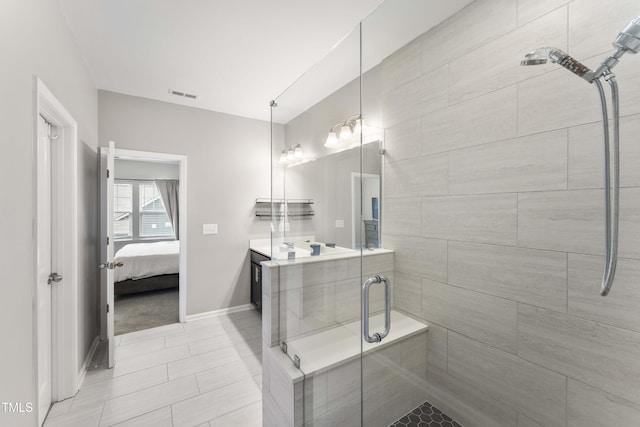 409 Rhamkatte Rd, Holly Springs, NC 27540 - full bath with a shower stall, ensuite bath, vanity, baseboards, and tile patterned floors