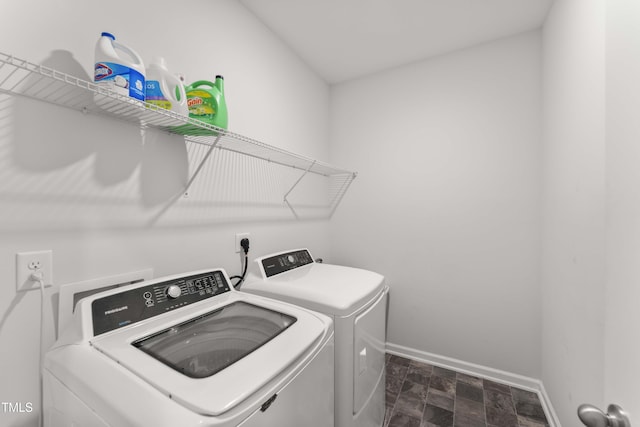 409 Rhamkatte Rd, Holly Springs, NC 27540 - laundry room featuring washer and clothes dryer and baseboards