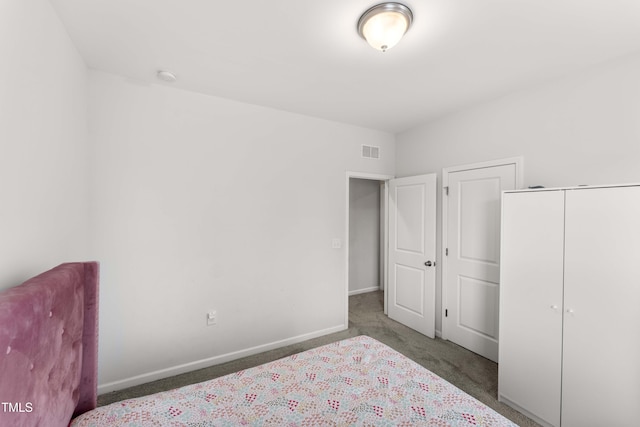 409 Rhamkatte Rd, Holly Springs, NC 27540 - bedroom featuring carpet floors, baseboards, and a closet