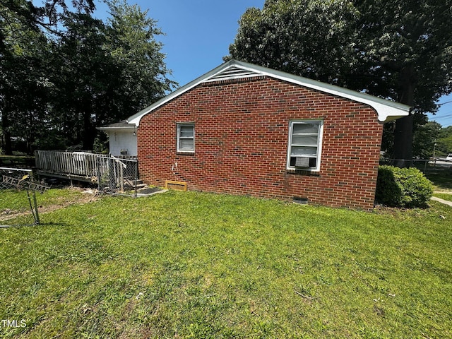 1445 E Chaloner Dr, Roanoke Rapids, NC 27870 - view of home's exterior with a yard, brick siding, and a wooden deck