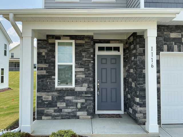 1116 Sidney Creek Dr Unit 1116, Zebulon, NC 27597 - entrance to property with stone siding and a garage