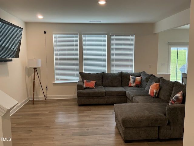 1116 Sidney Creek Dr Unit 1116, Zebulon, NC 27597 - living room with light wood finished floors, recessed lighting, and baseboards