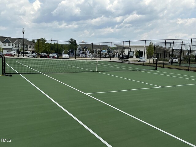 1116 Sidney Creek Dr Unit 1116, Zebulon, NC 27597 - view of tennis court featuring a residential view