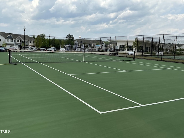 1116 Sidney Creek Dr Unit 1116, Zebulon, NC 27597 - view of tennis court featuring a residential view