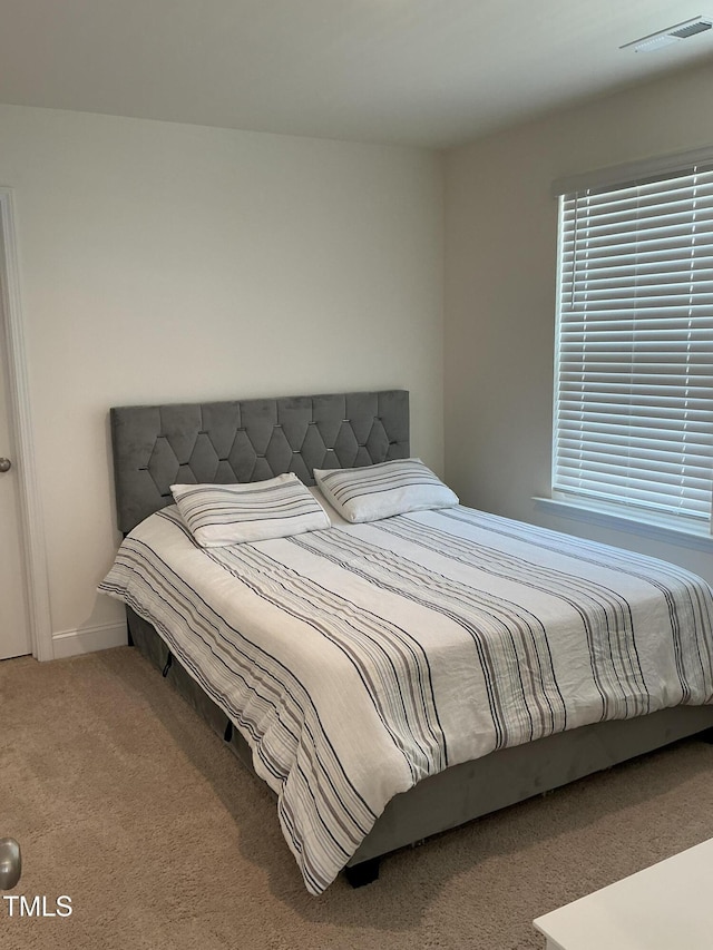 1116 Sidney Creek Dr Unit 1116, Zebulon, NC 27597 - carpeted bedroom featuring baseboards