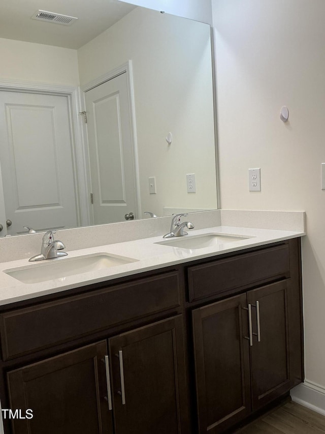 1116 Sidney Creek Dr Unit 1116, Zebulon, NC 27597 - full bath with double vanity and wood finished floors
