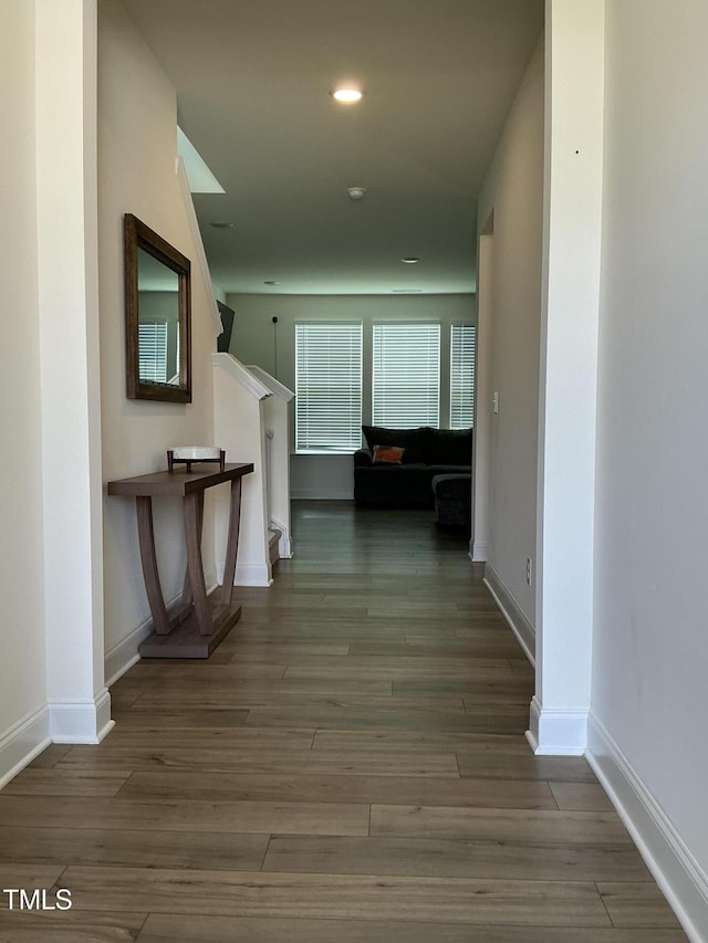 1116 Sidney Creek Dr Unit 1116, Zebulon, NC 27597 - hall with wood finished floors, stairway, baseboards, and recessed lighting