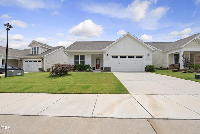 537 Bramble Ln, Clayton, NC 27527 - view of front of home featuring board and batten siding, a garage, a front yard, and driveway