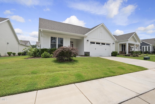 537 Bramble Ln, Clayton, NC 27527 - view of front of property with board and batten siding, an attached garage, a front yard, driveway, and a shingled roof
