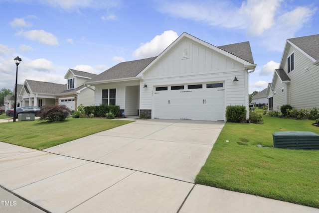 537 Bramble Ln, Clayton, NC 27527 - view of front facade with board and batten siding, a garage, a front lawn, and concrete driveway