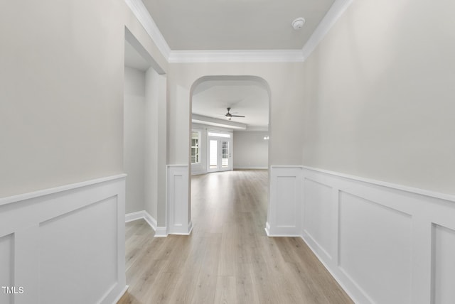537 Bramble Ln, Clayton, NC 27527 - hall featuring ornamental molding, light wood-style floors, arched walkways, and a wainscoted wall