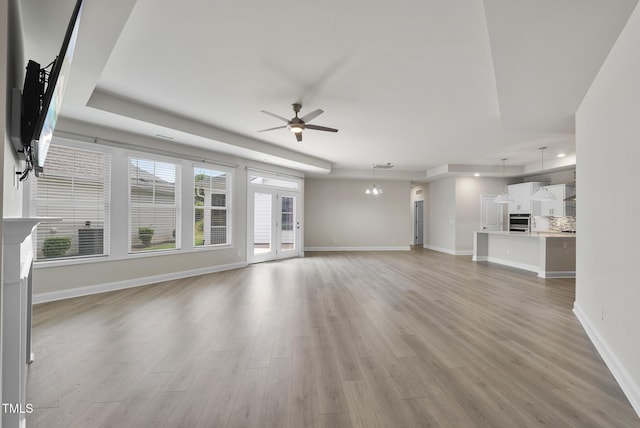 537 Bramble Ln, Clayton, NC 27527 - unfurnished living room with a ceiling fan and light wood finished floors