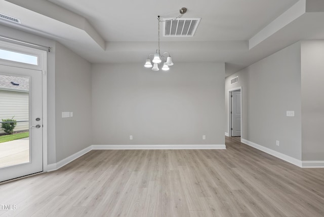 537 Bramble Ln, Clayton, NC 27527 - empty room with a chandelier and light wood finished floors
