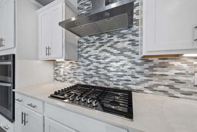 537 Bramble Ln, Clayton, NC 27527 - kitchen featuring range hood, appliances with stainless steel finishes, white cabinets, backsplash, and light stone countertops
