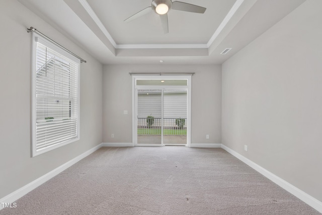 537 Bramble Ln, Clayton, NC 27527 - unfurnished room featuring a tray ceiling, carpet, a ceiling fan, and crown molding