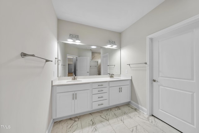537 Bramble Ln, Clayton, NC 27527 - bathroom featuring double vanity, marble look tiles, and a shower