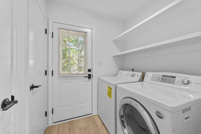 413 Top Greene Ln, Raleigh, NC 27601 - washroom with washer and clothes dryer and light wood-style floors