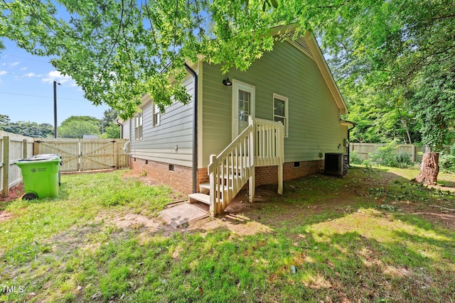413 Top Greene Ln, Raleigh, NC 27601 - back of property featuring crawl space, a gate, and central AC unit