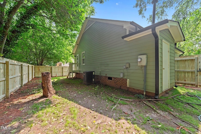413 Top Greene Ln, Raleigh, NC 27601 - view of side of property featuring central air condition unit, crawl space, and a fenced backyard