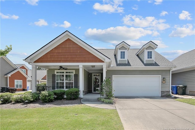 239 Nandina Ct Unit 21A, Fayetteville, NC 28311 - view of front of home with covered porch, a garage, driveway, a front yard, and roof with shingles
